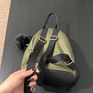 Olive Green Mini Backpack with Black Trim and Pom Accent